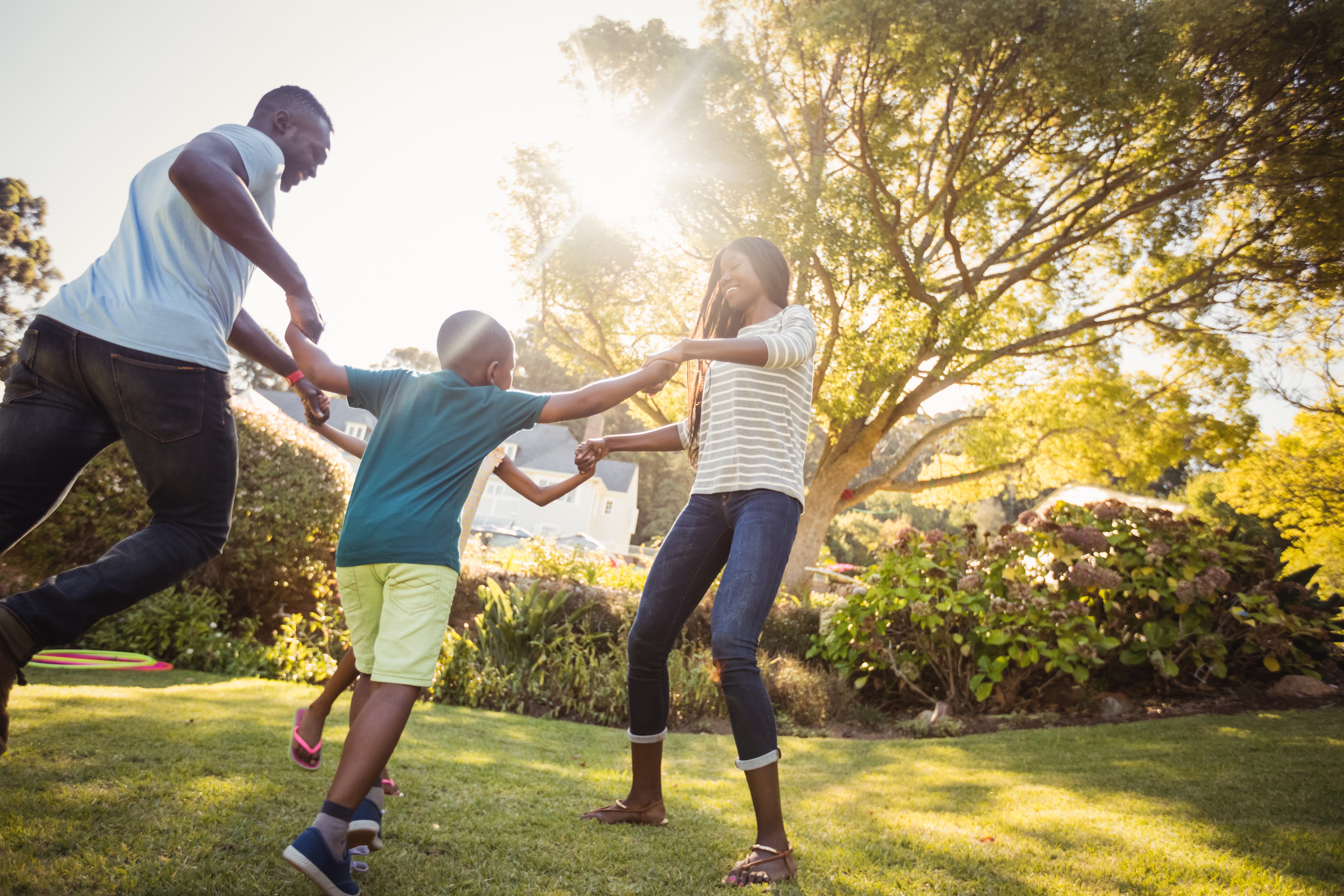 family playing in a backyard