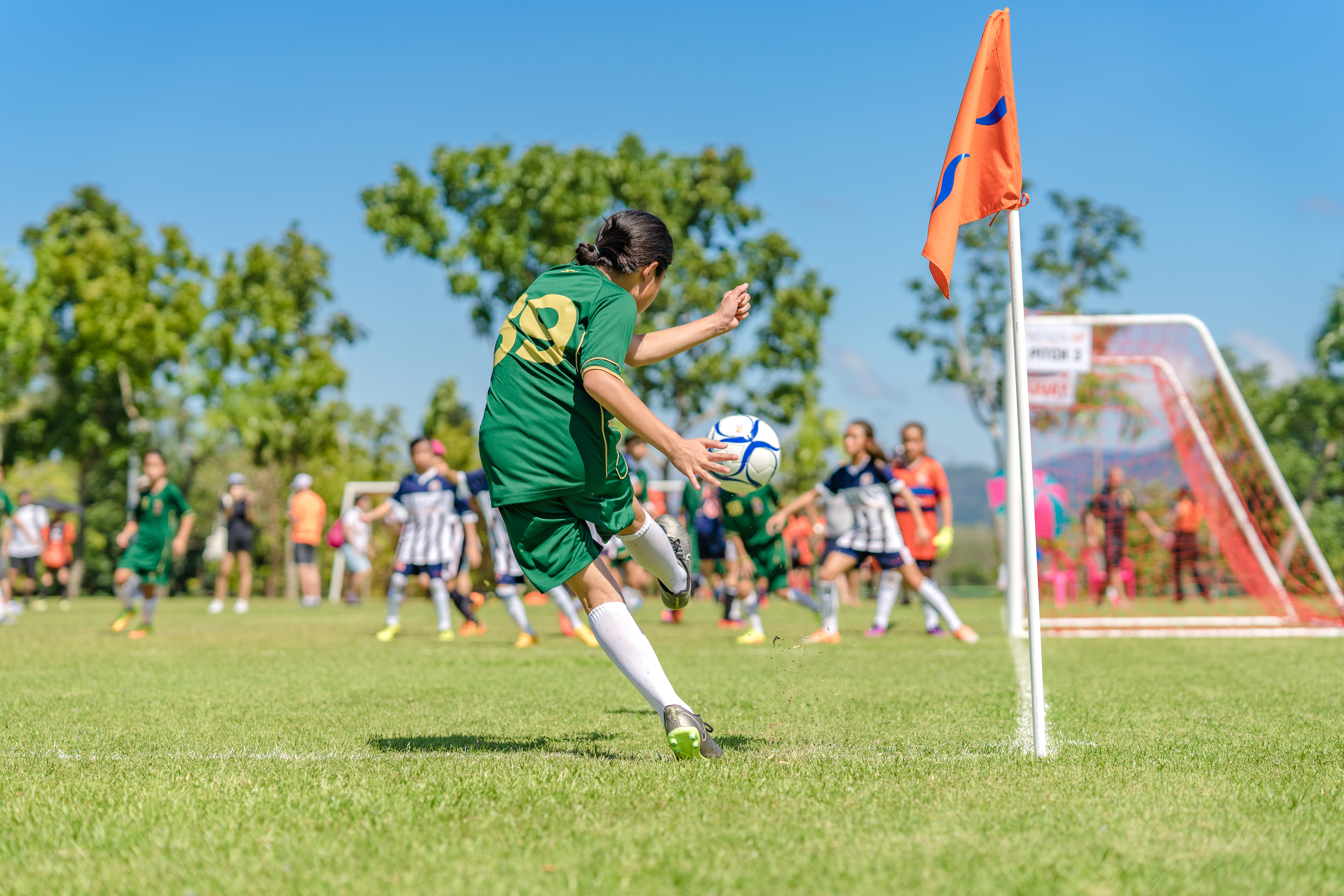 A soccer player kicks a ball