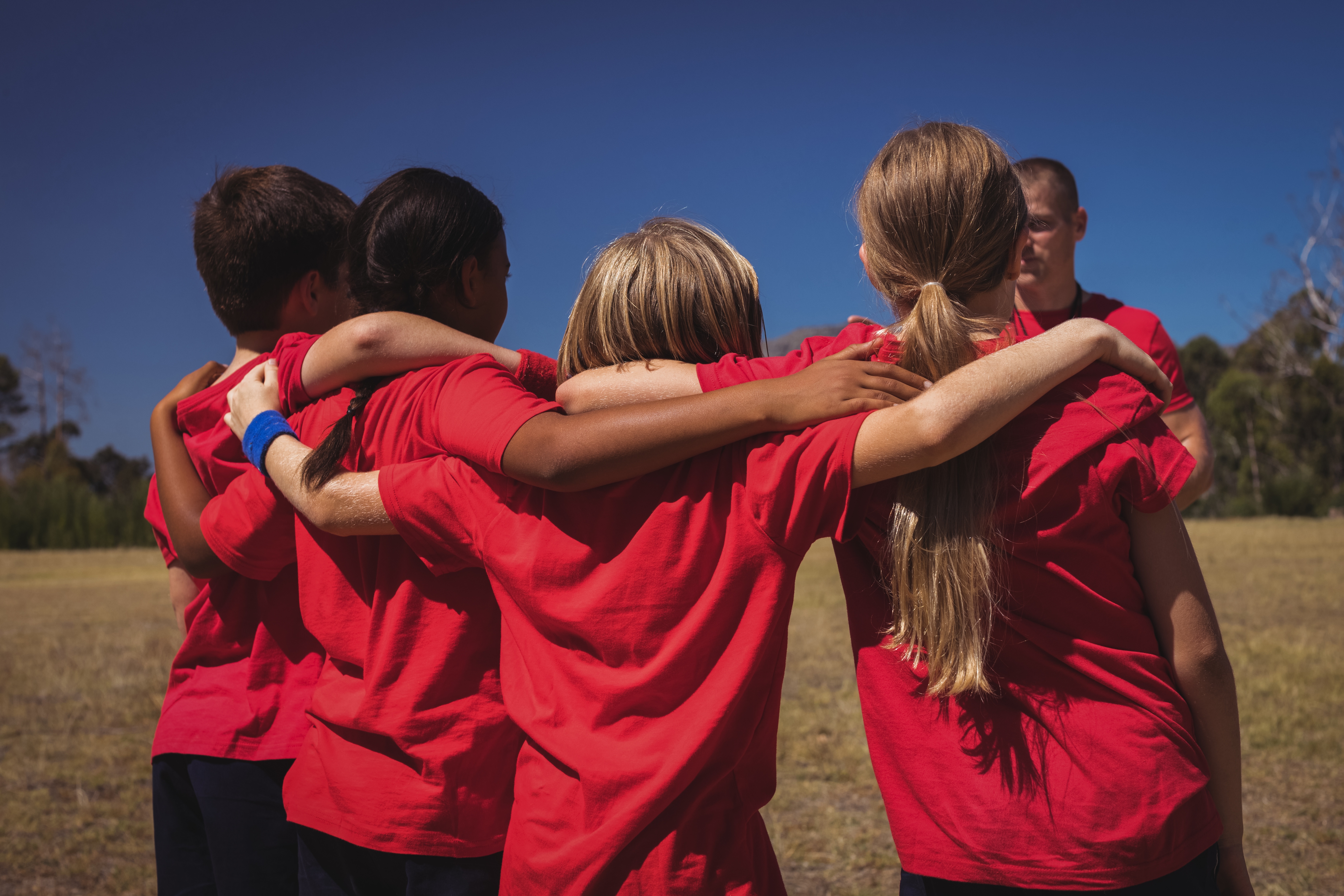 youth in team huddle