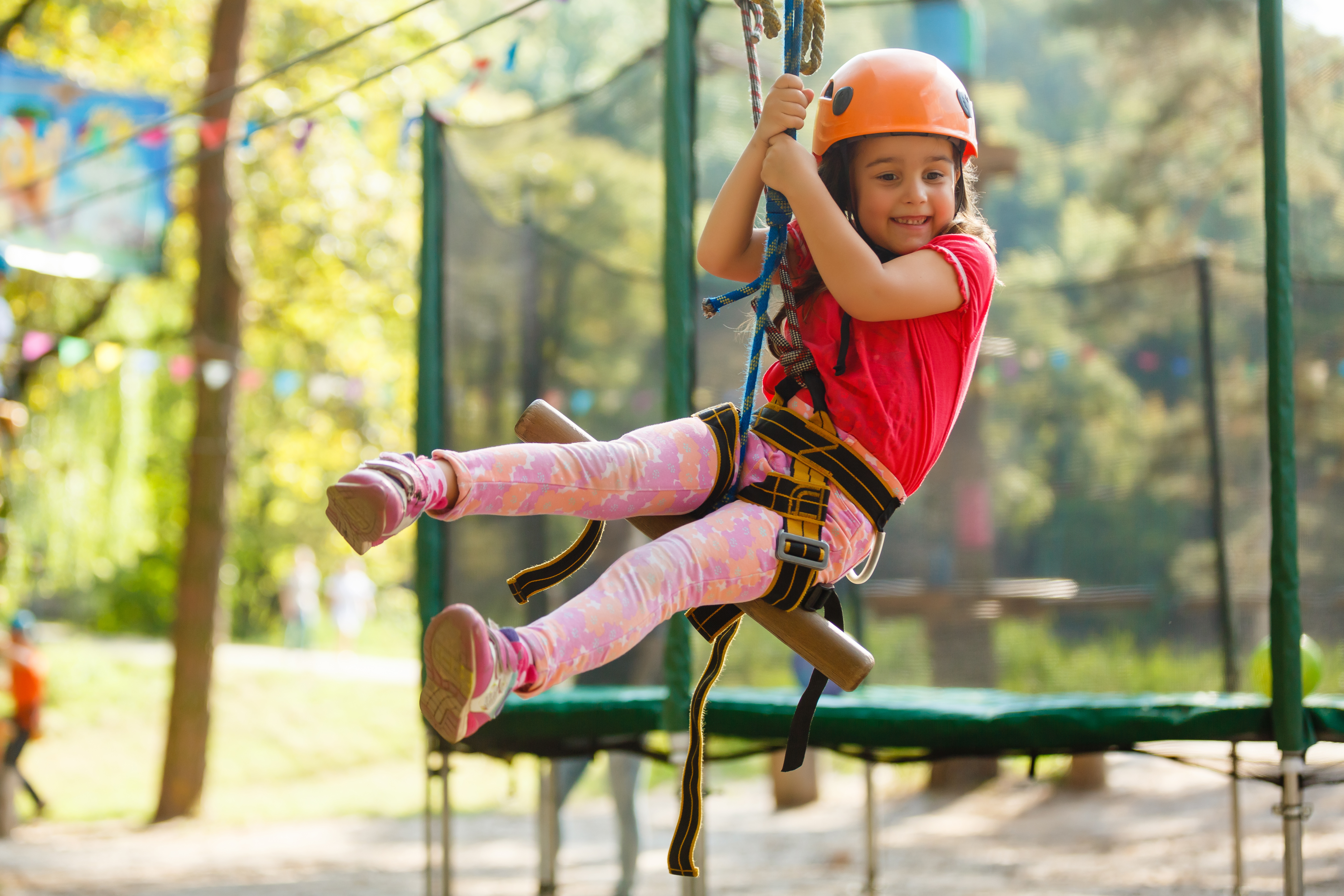 little girl on a zip line