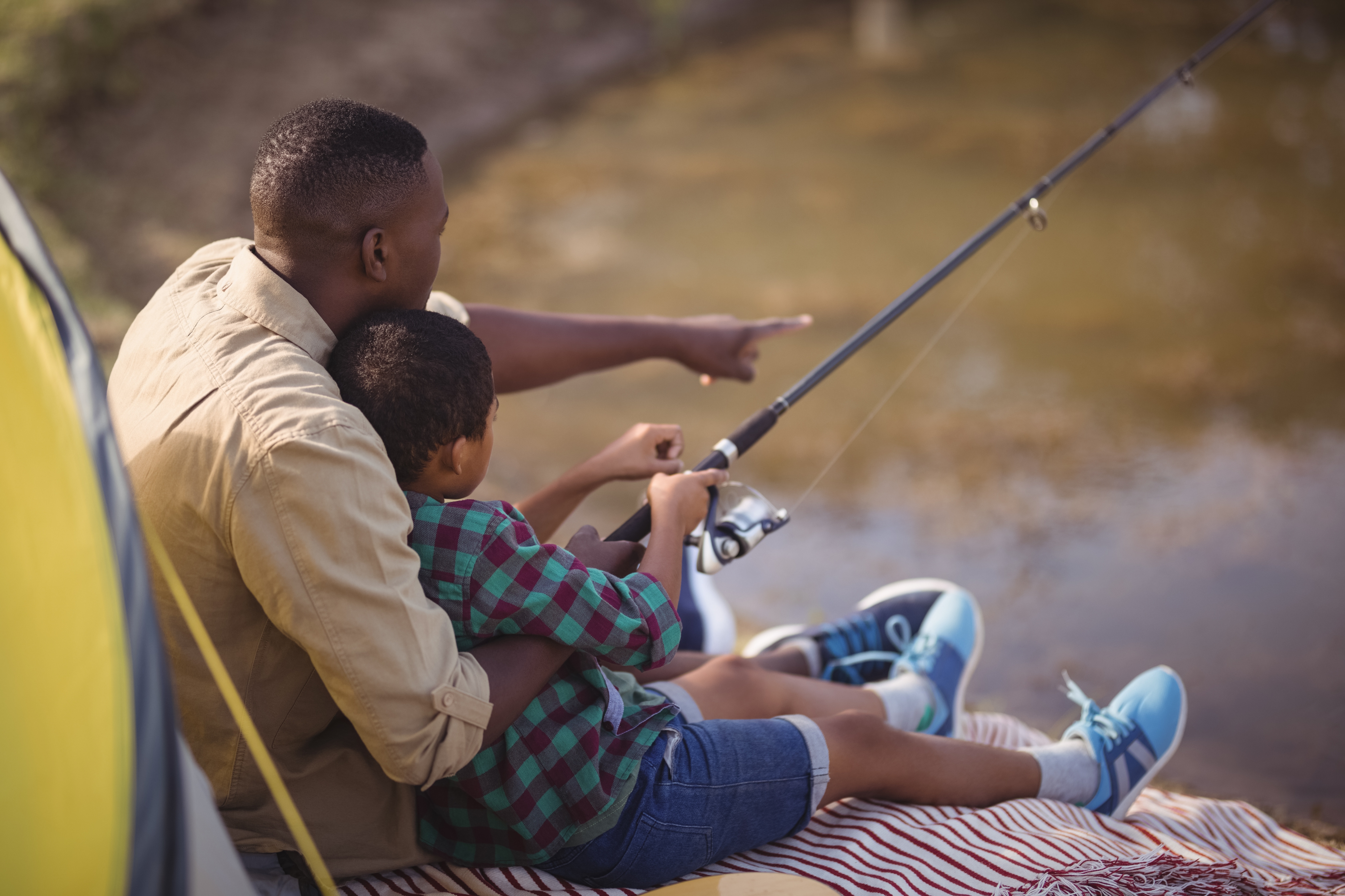 father and son fishing together