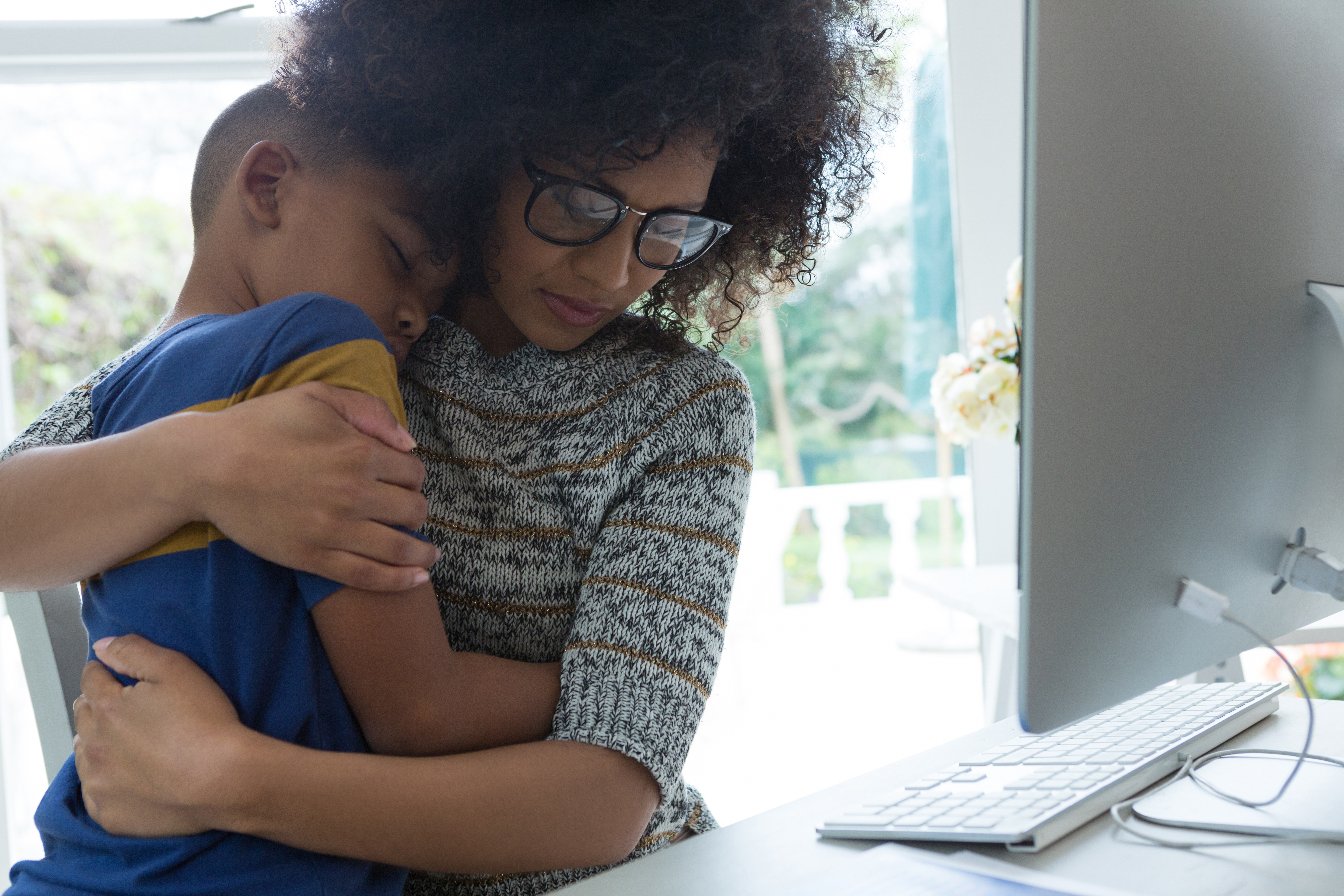 mother and son hugging