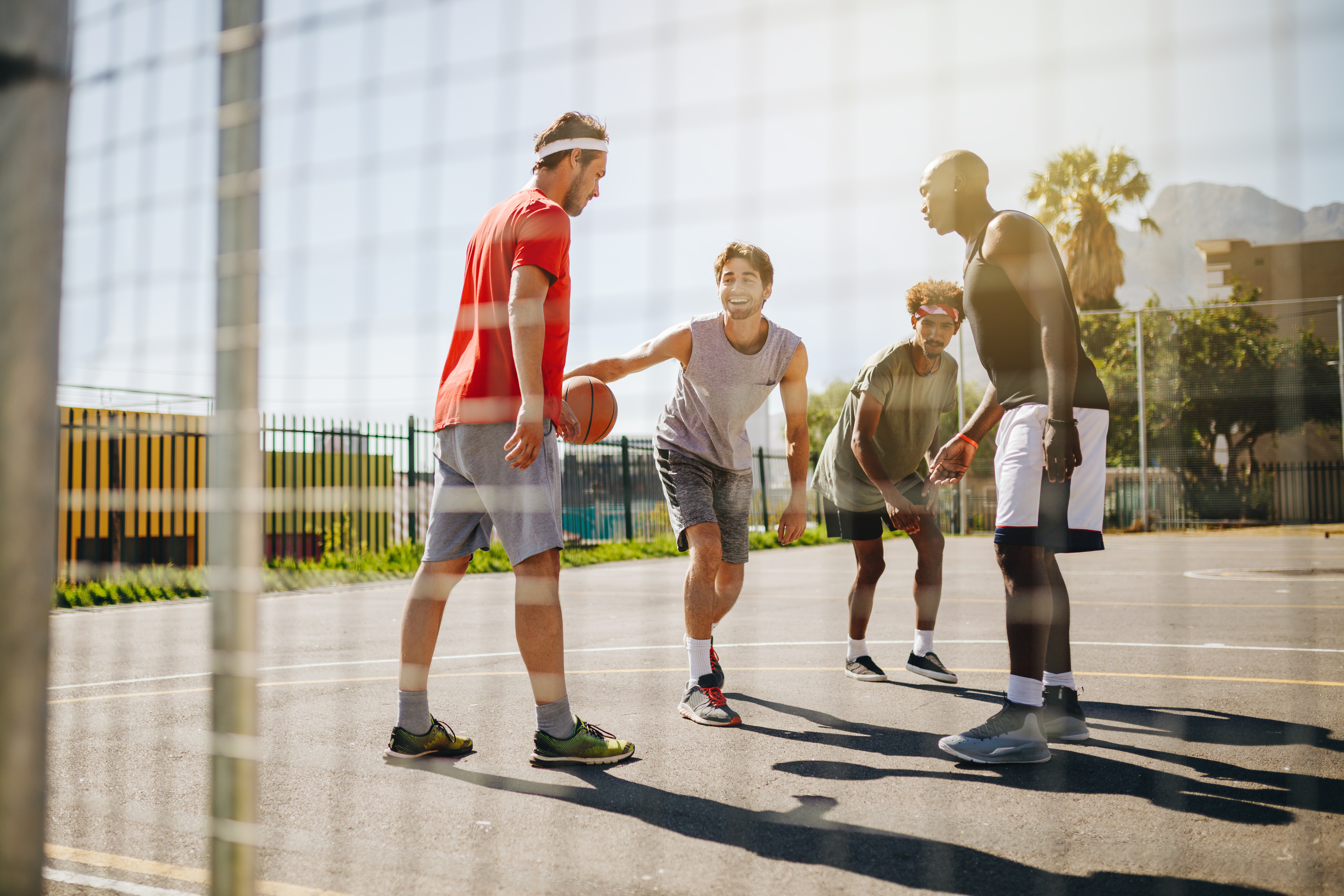 young men playing basketball