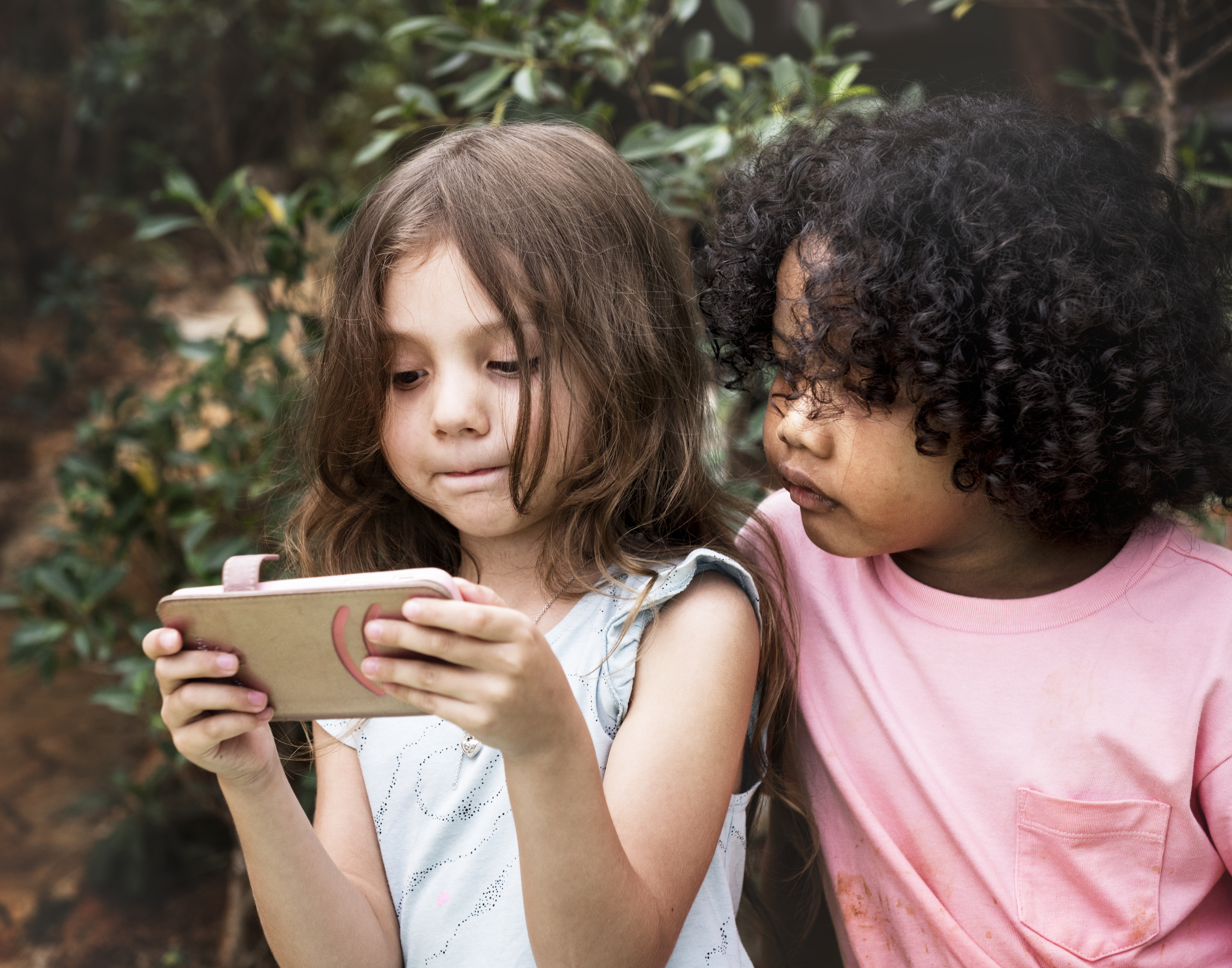 kids looking at a phone