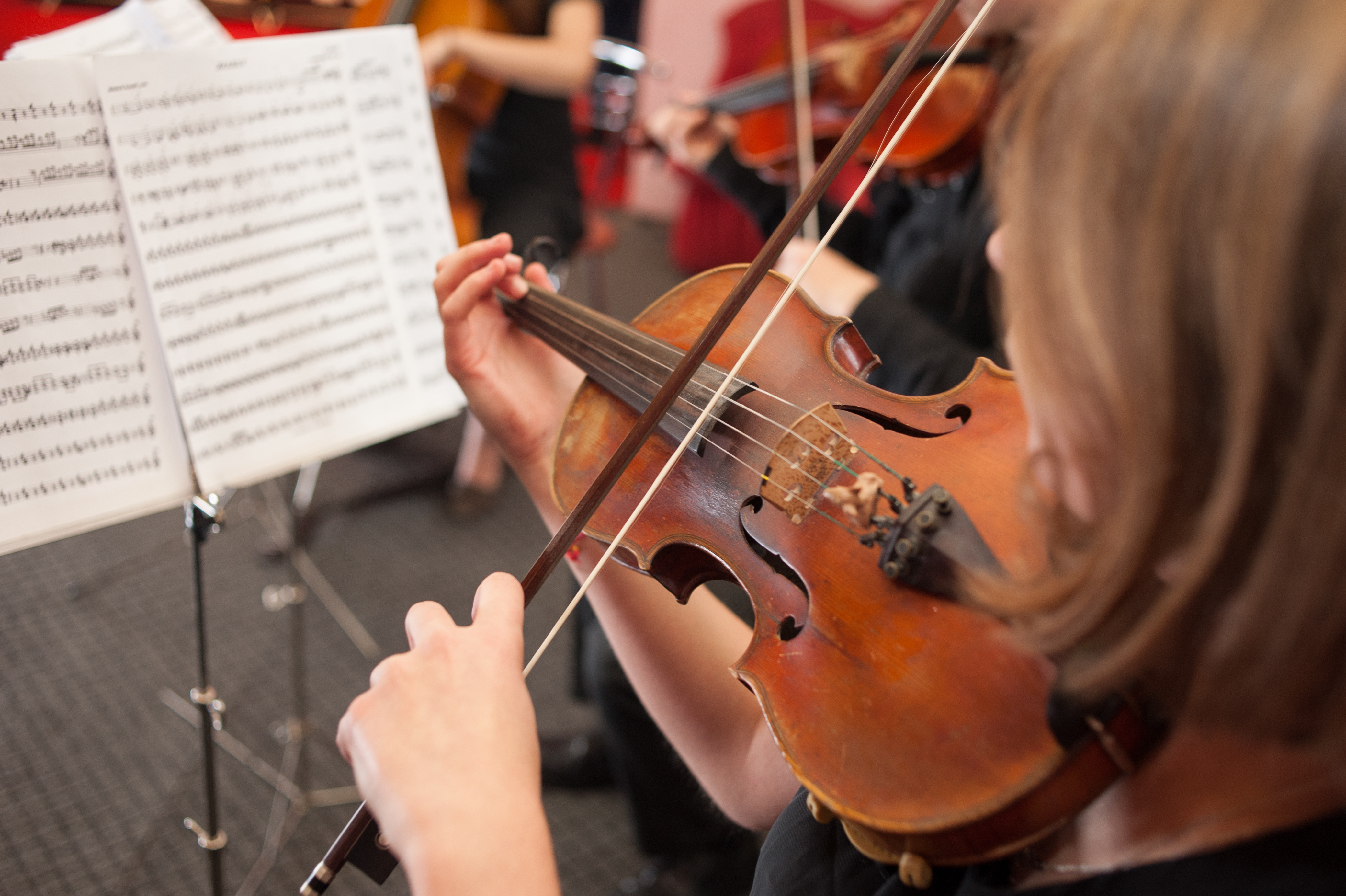 violinist in a school orchestra