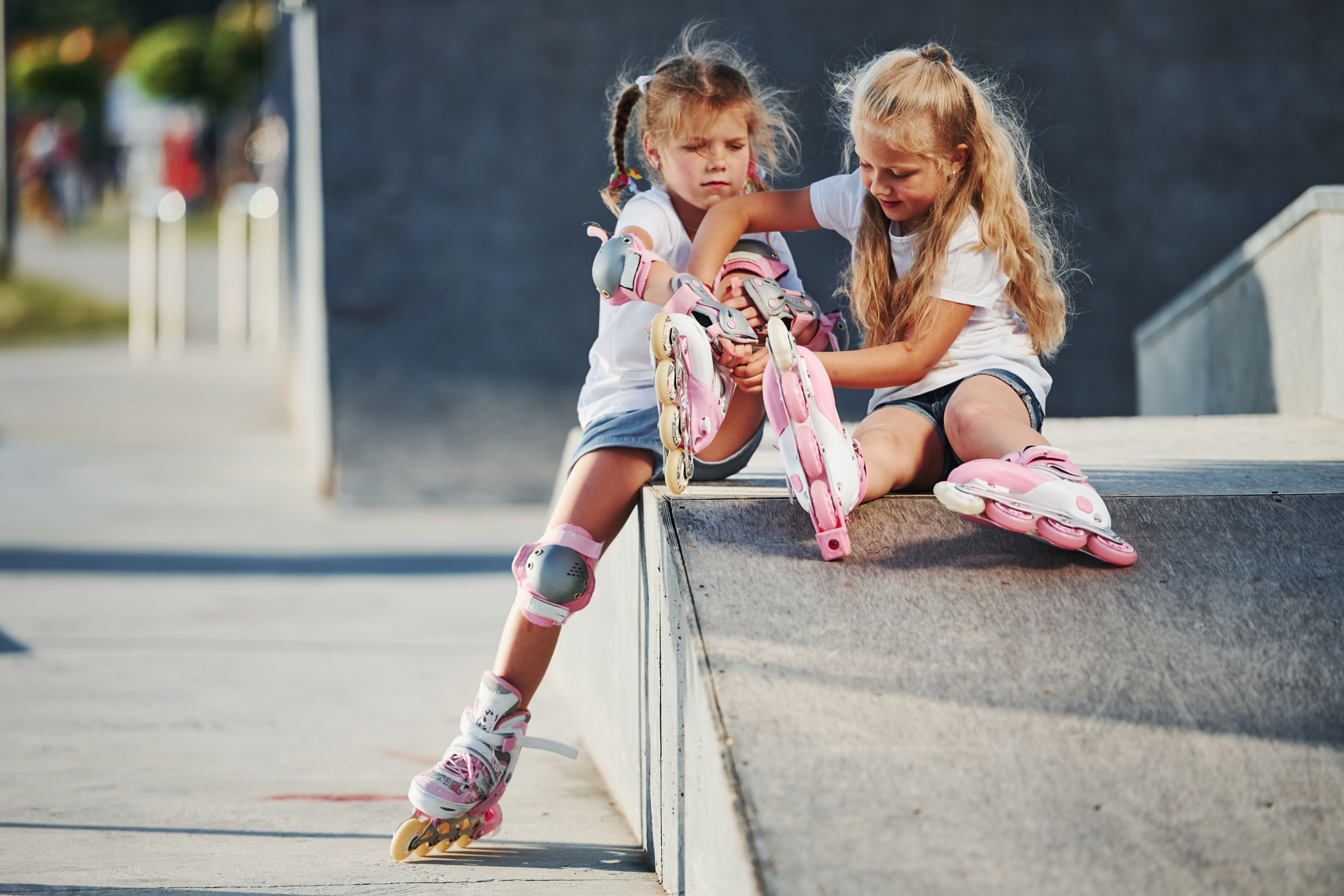 two little girls with roller blades