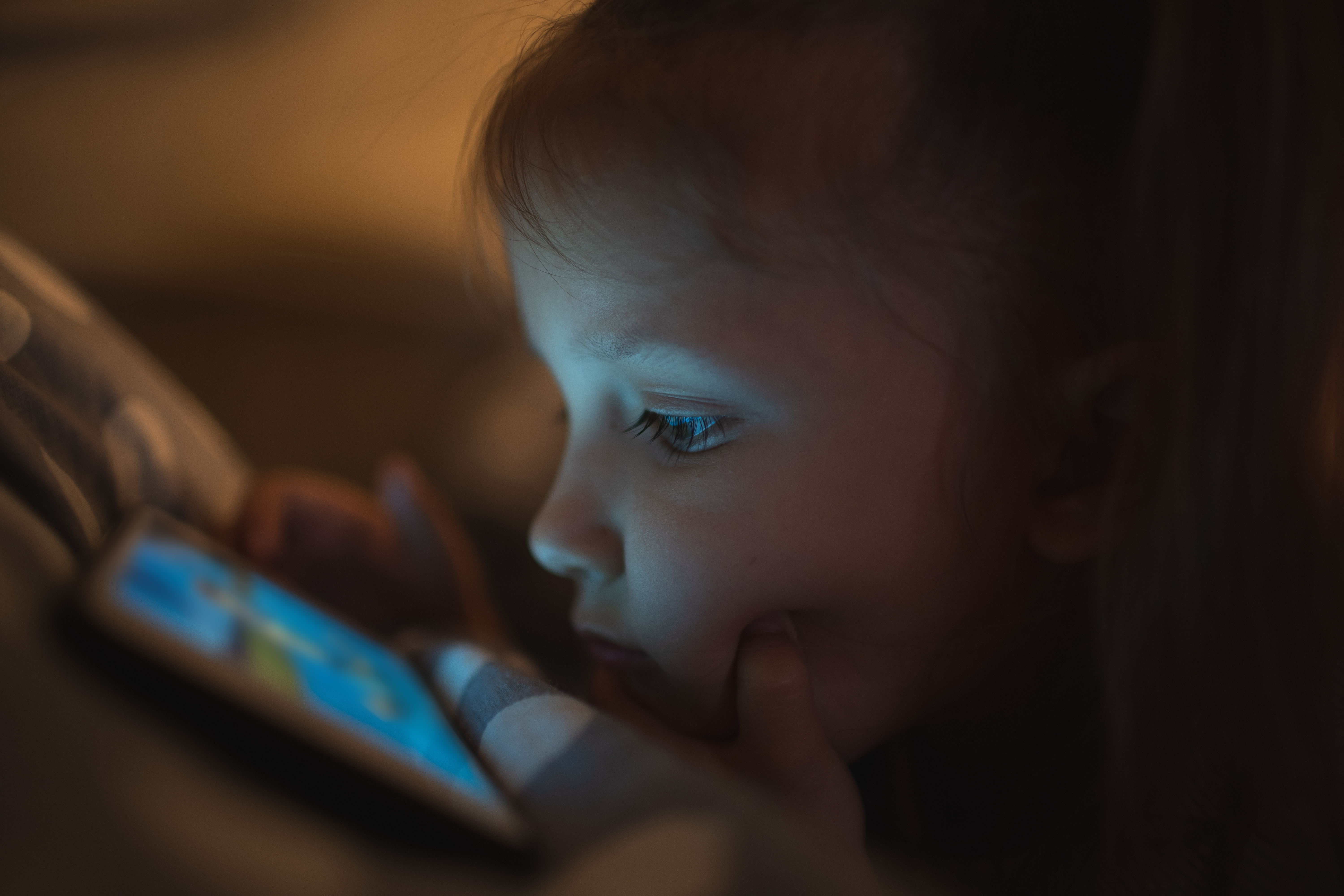 child staring at a screen