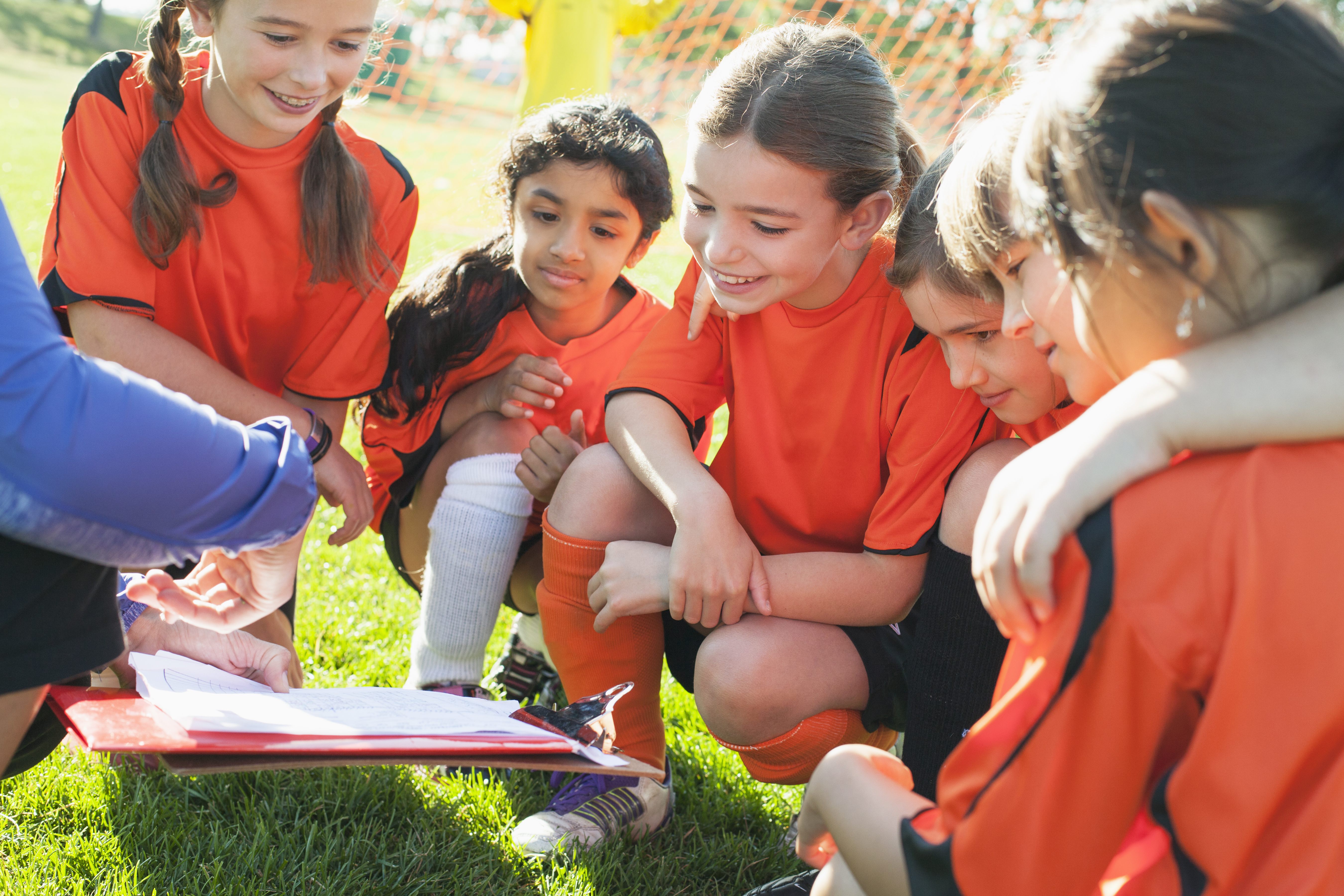 soccer team in a huddle