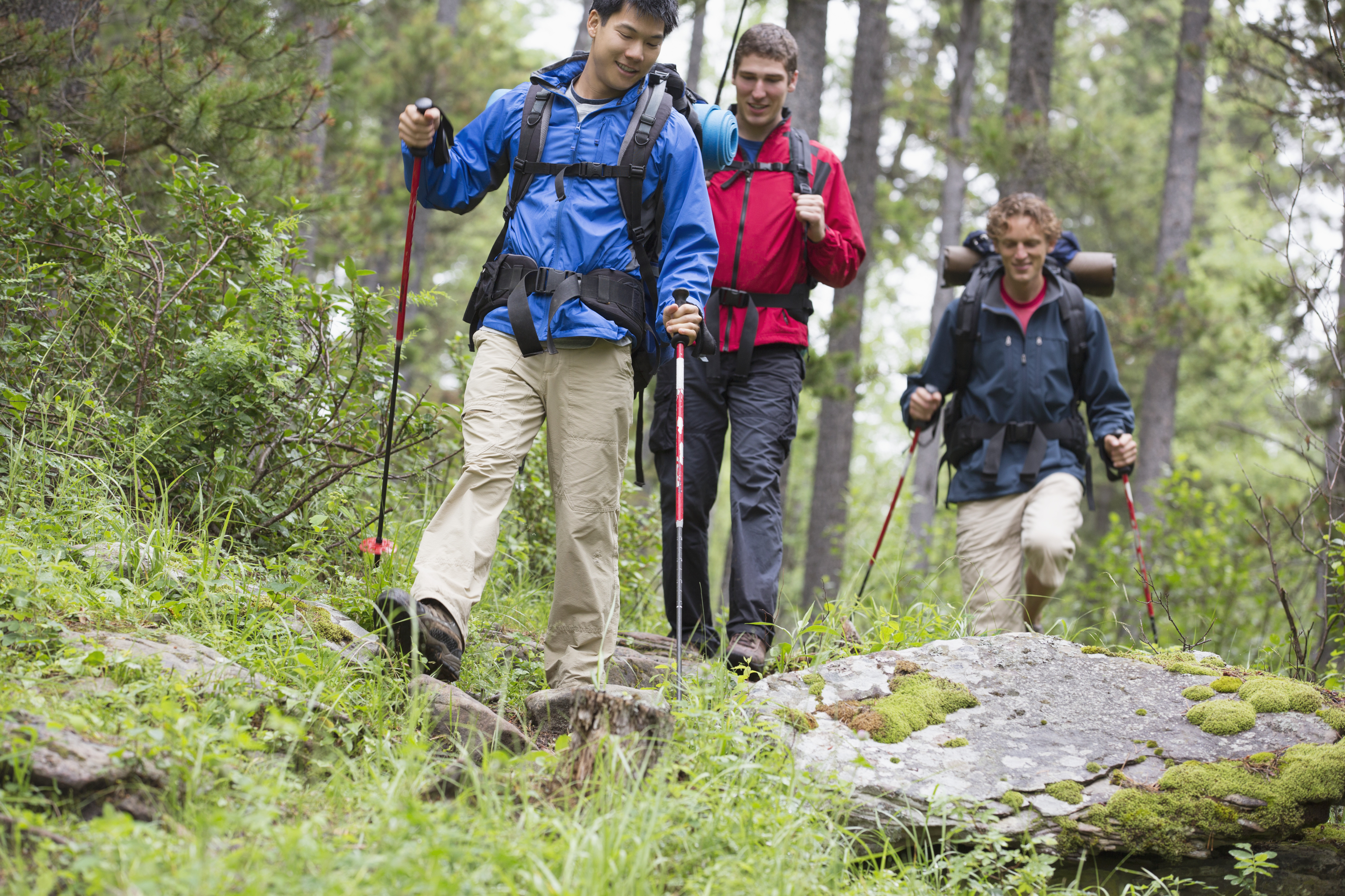 young men hiking with backpacks