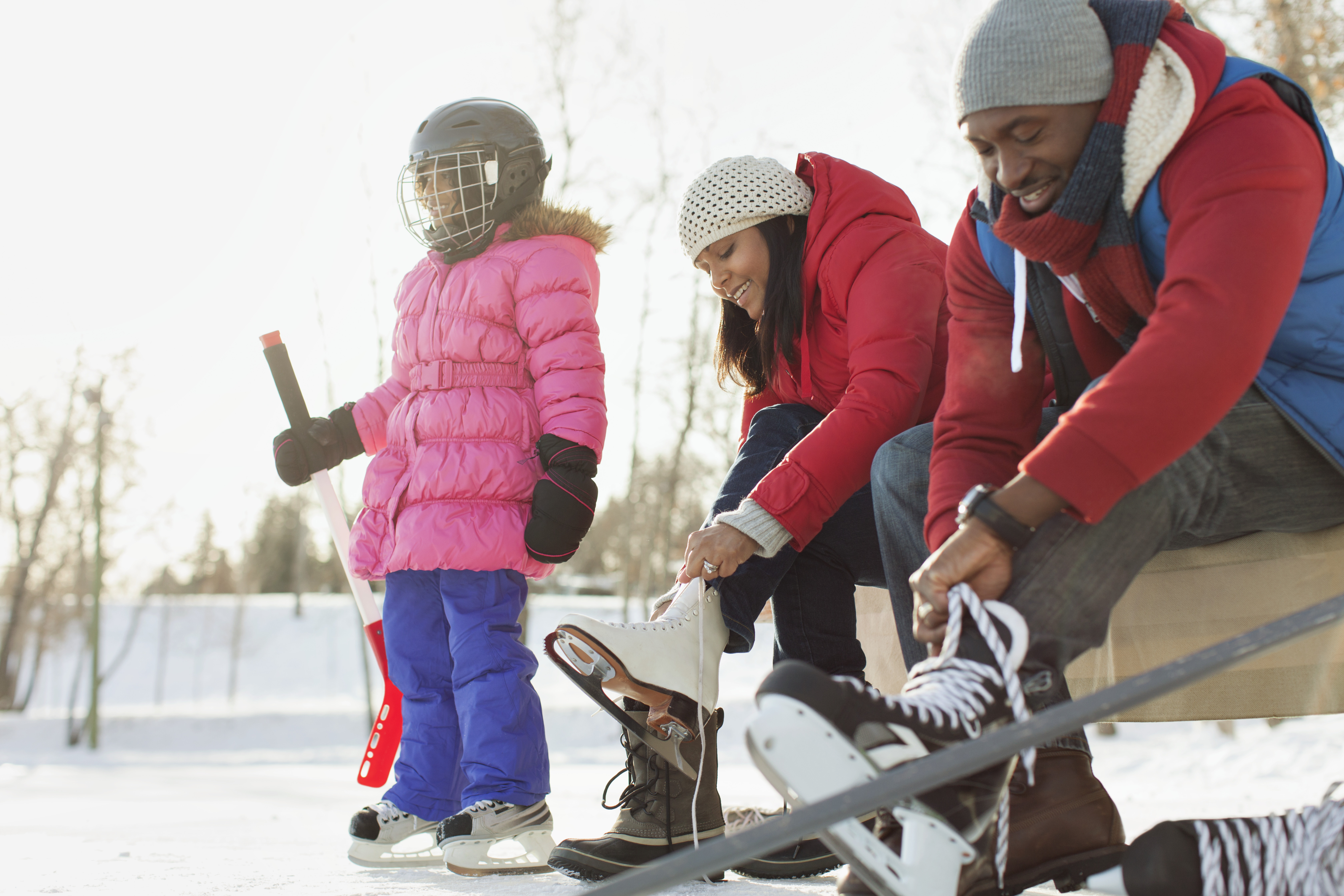 family preparing to ice skate