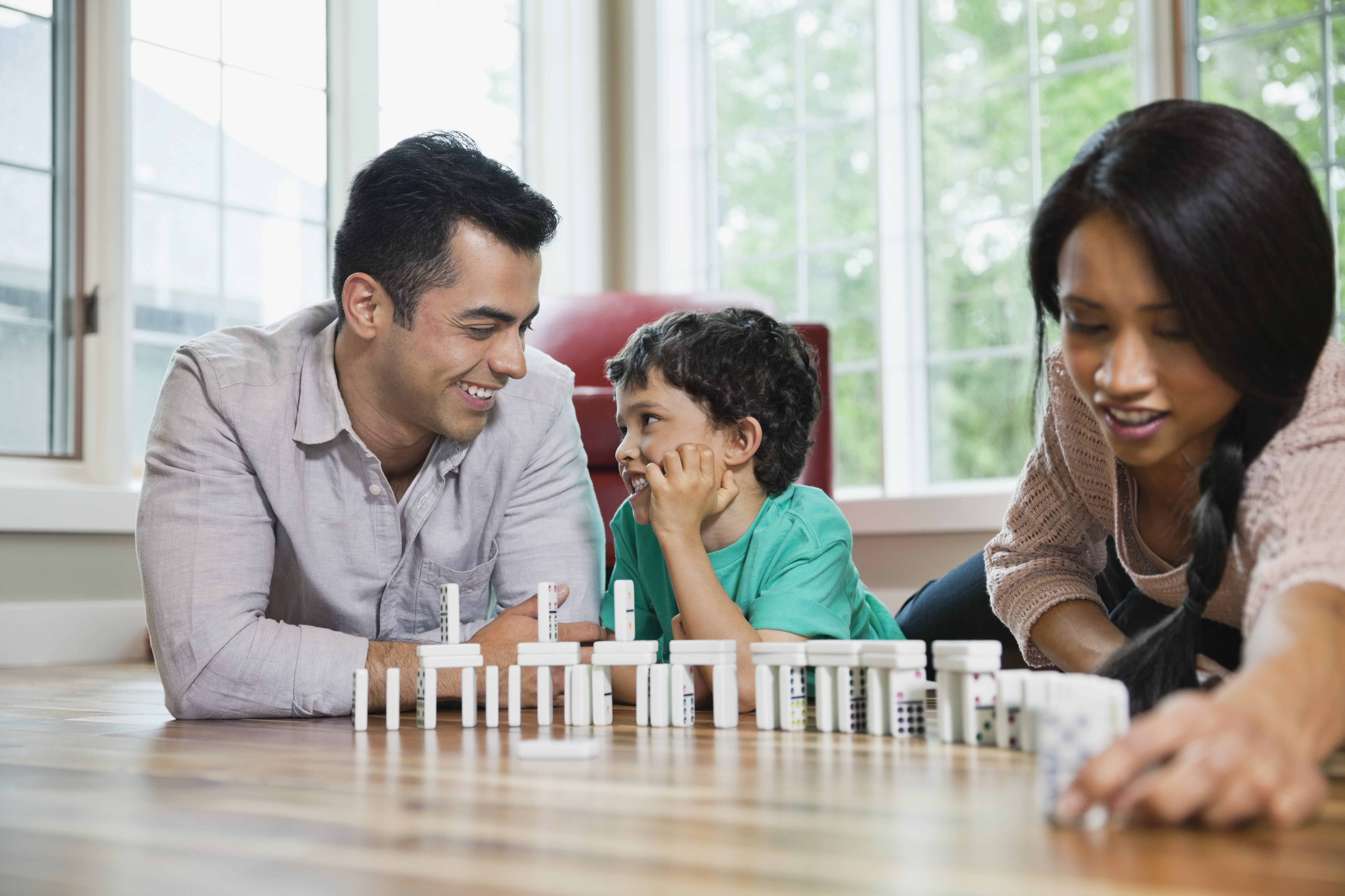 family playing dominoes