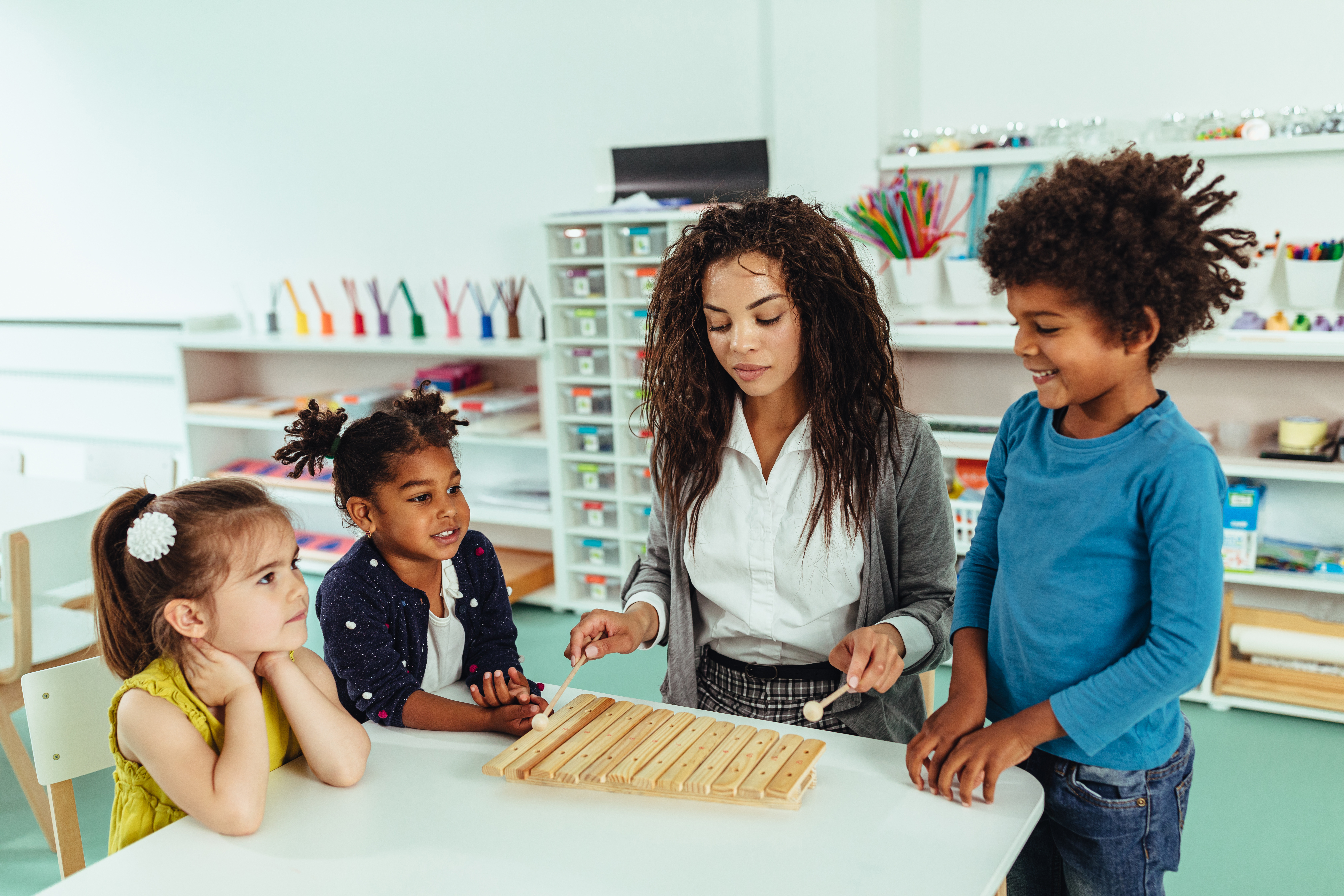 music teacher with several young students