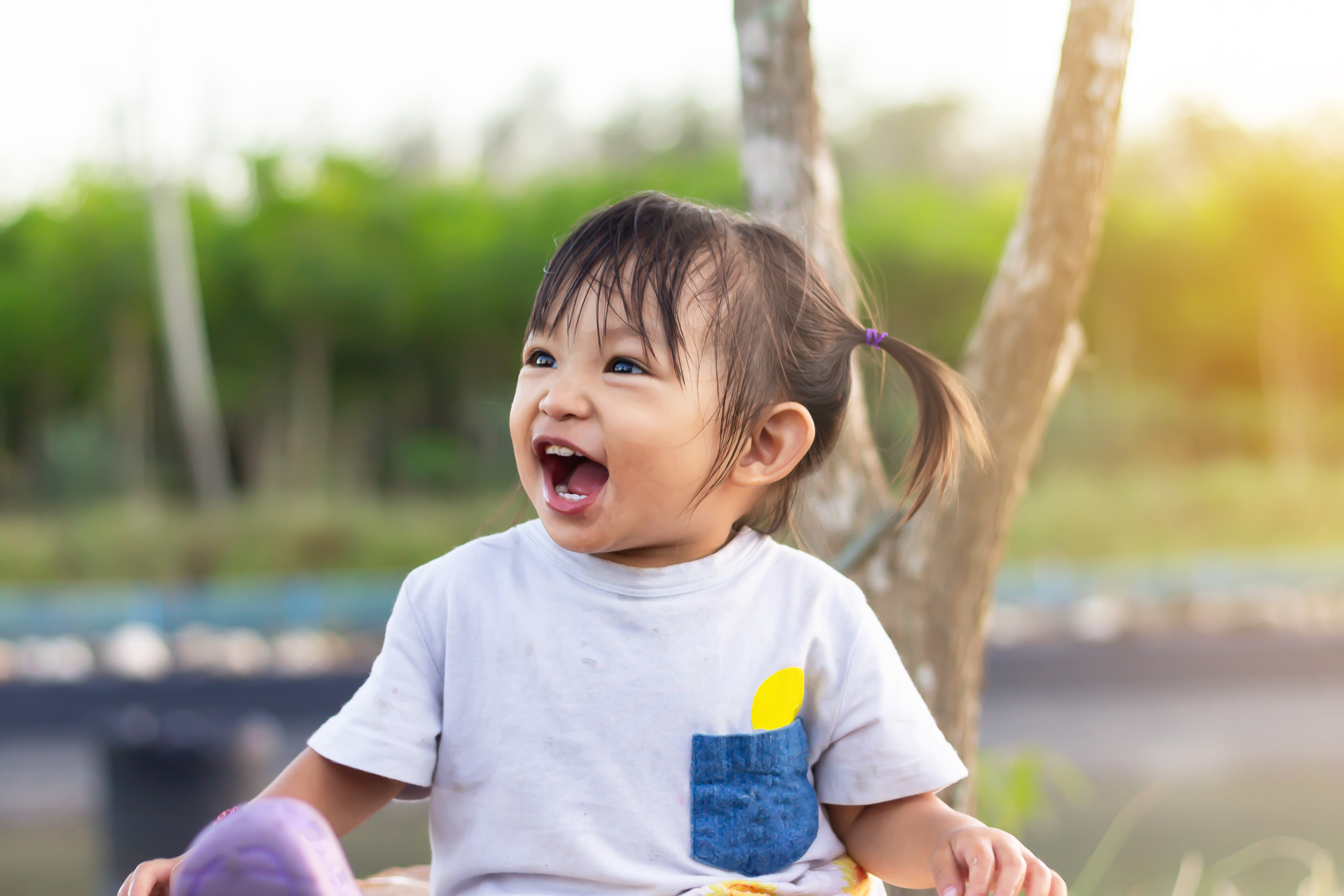 a little girl enjoys the park