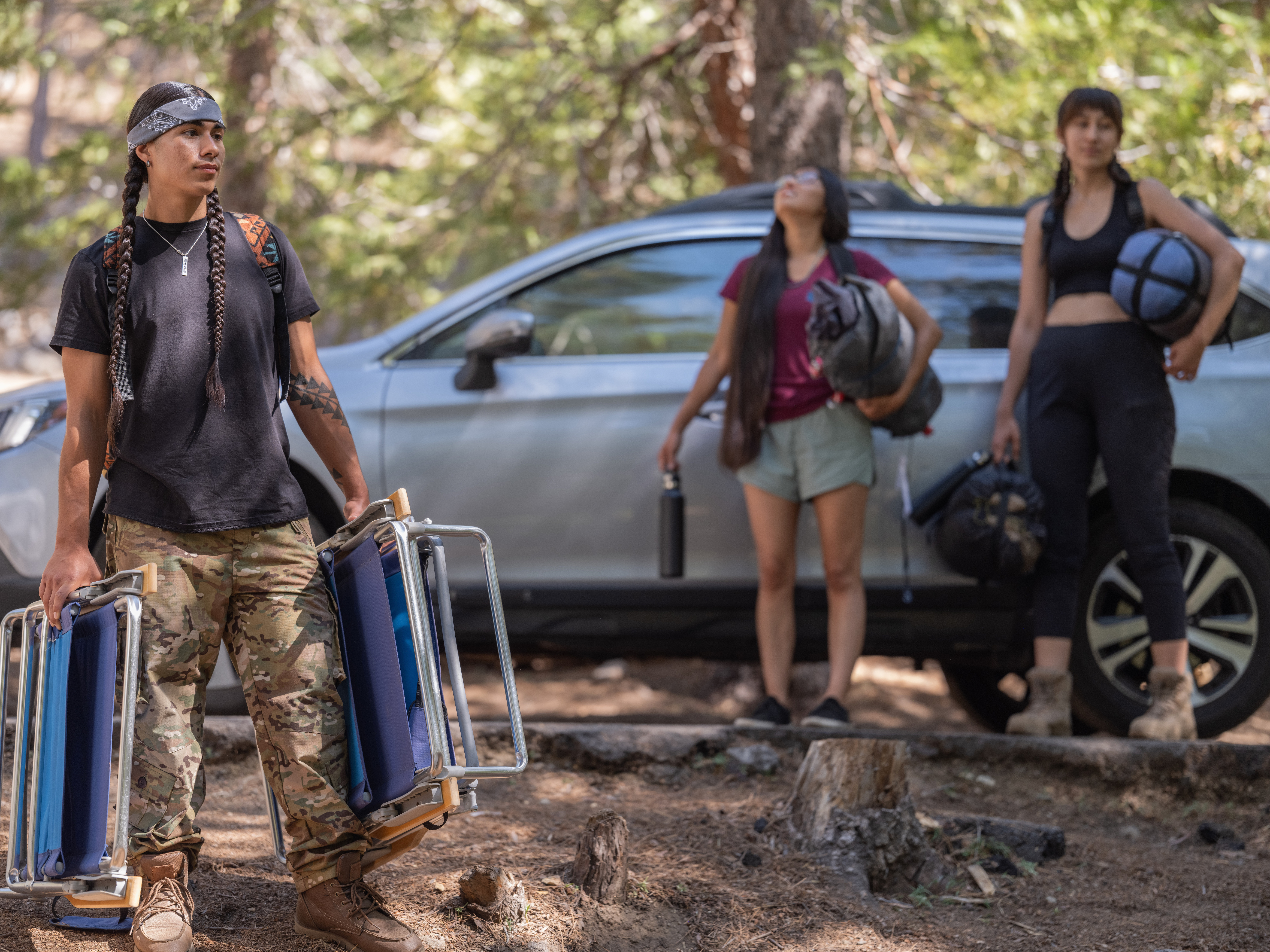 A group of youth set up a campsite