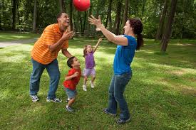 image of family playing outside