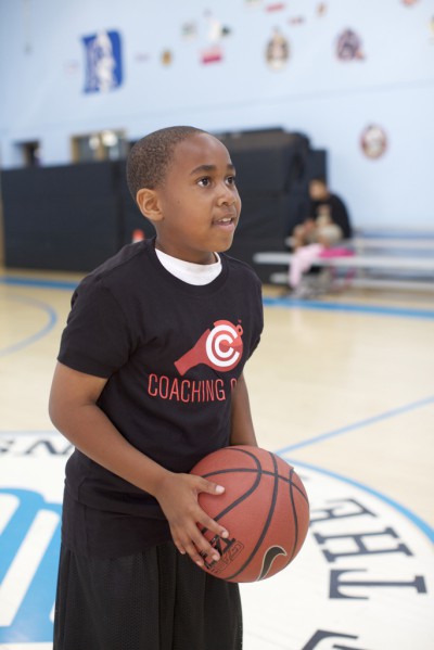 Kid playing basketball